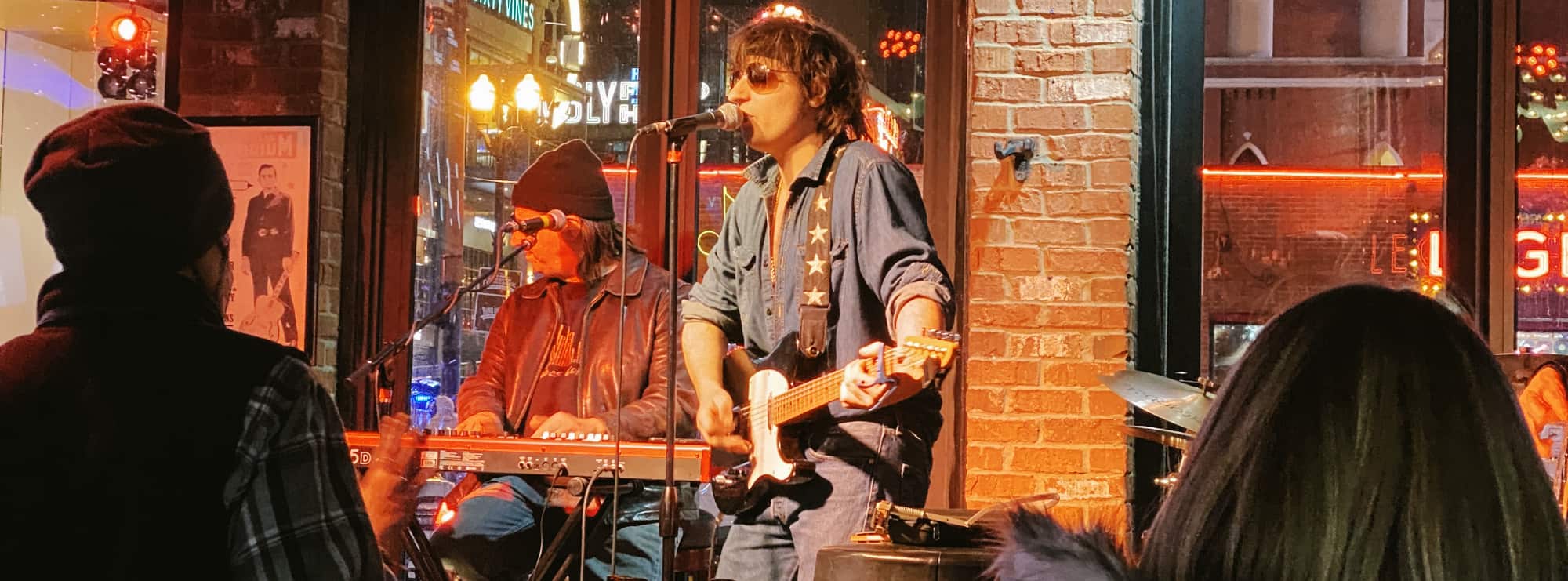 bar singer on guitar in Davenport
