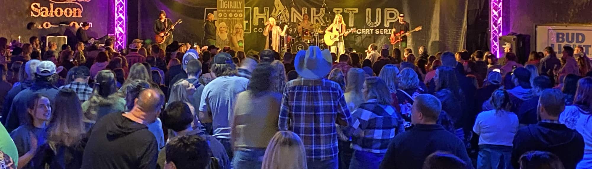 country concert with fans wearing cowboy hats Davenport