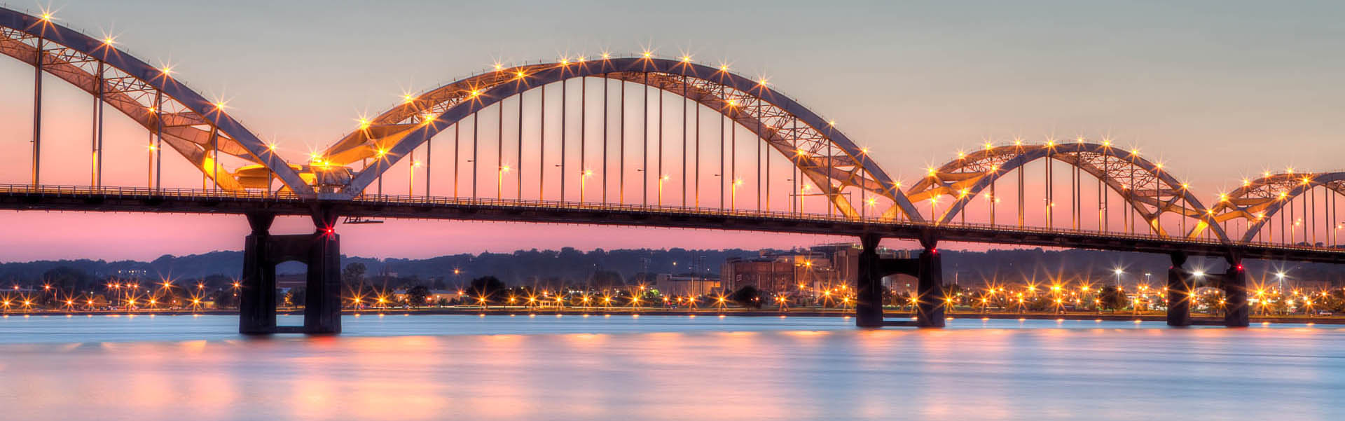 Neon color image of a band playing and people singing along