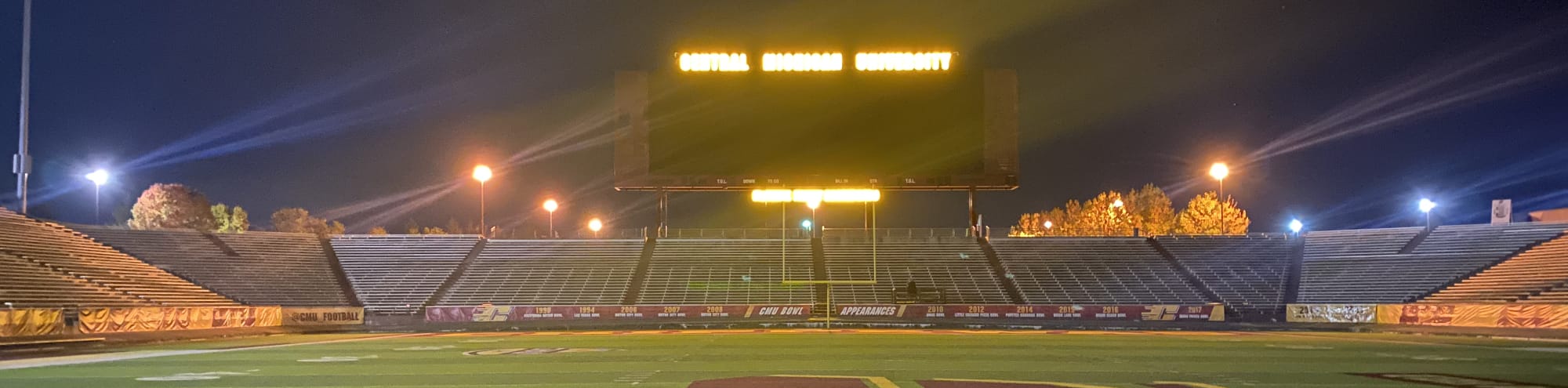 empty football stadium at night under the lights Davenport